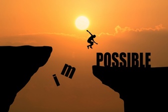 man-jumping-over-impossible-or-possible-over-cliff-on-sunset-background-business-concept-idea_1323-265.jpg